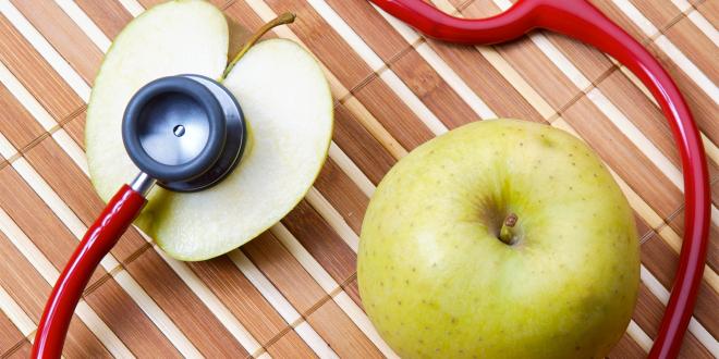 an apple and a stethoscope