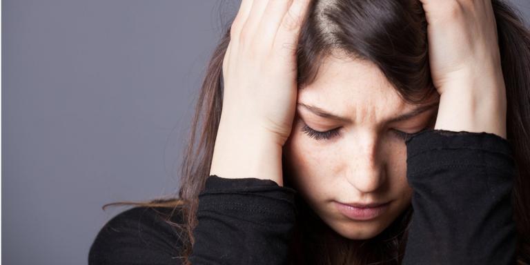 A woman looking sad and stressed